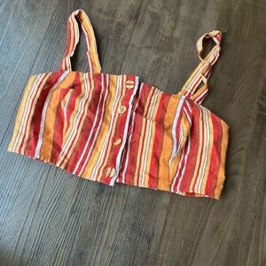 Multi color retro striped button down crop tank top with adjustable straps.